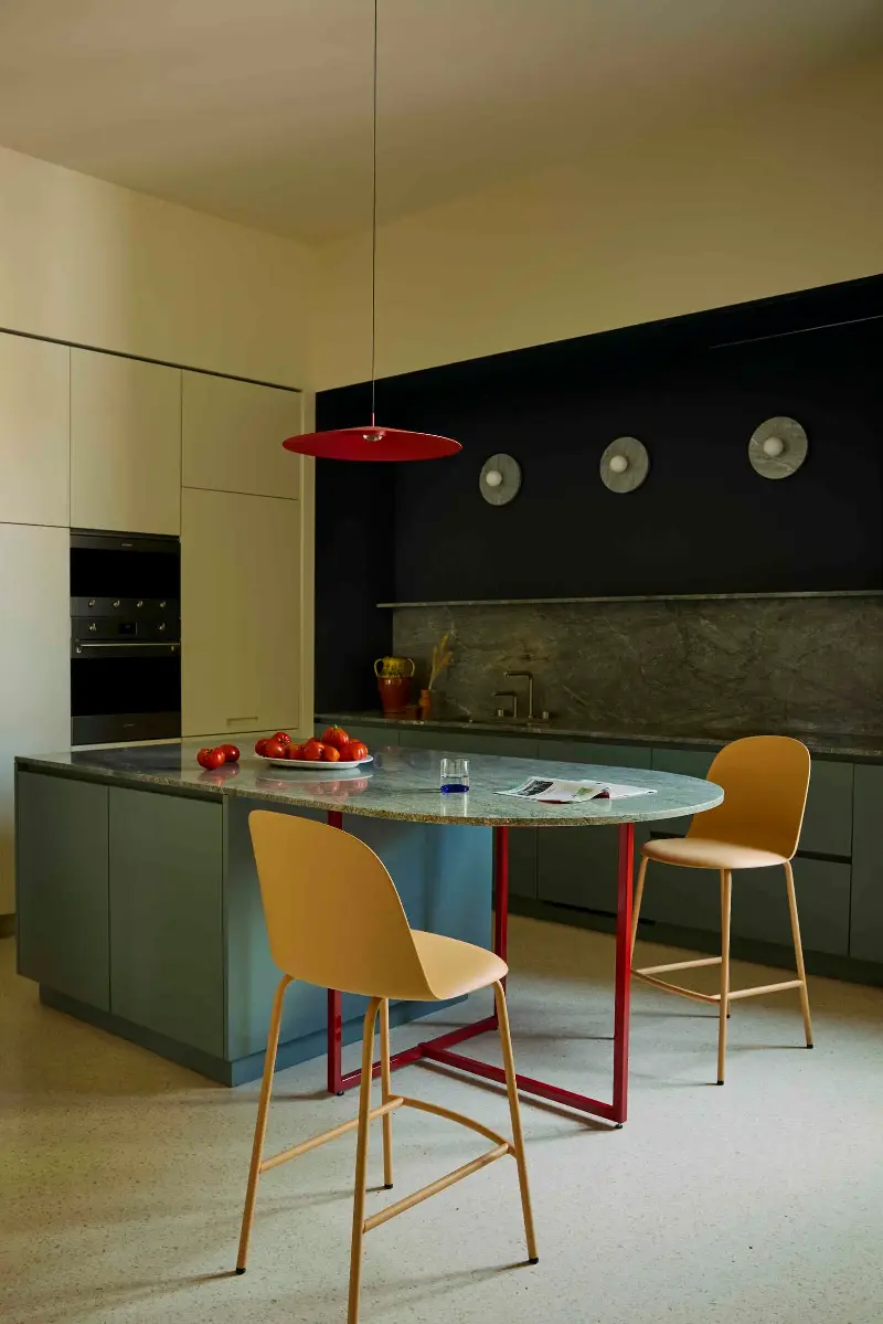 Even a detail like orange bar chairs helps warm a blue scheme. (Image credit: f)