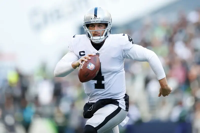 Derek Carr #4 of the Las Vegas Raiders scrambles during the first half in the game against the Seattle Seahawks at Lumen Field on November 27, 2022, in Seattle, Washington. (Photo by Steph Chambers/Getty Images)