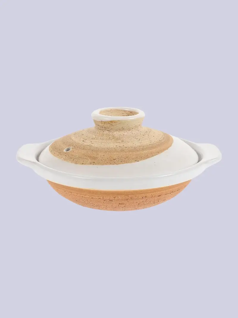 A beige and white Japanese donabe clay pot from Amazon