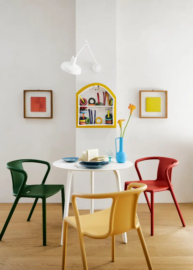 A trio of Air Dining Armchairs from Magis and a matching First Table from the brand carve out a space to feast. (Image credit: Thomas Pagani. Design: Studio Paradisiartificiali with Owen Gent. Styling: Giulia Taglialatela)