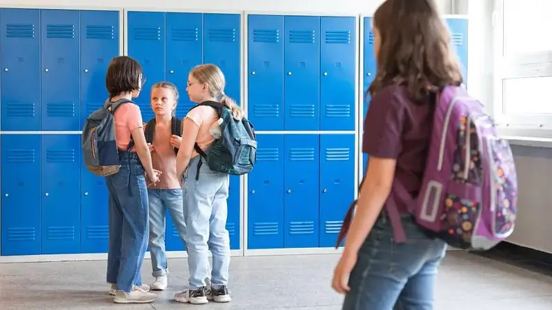 School girls standing in the school corridor