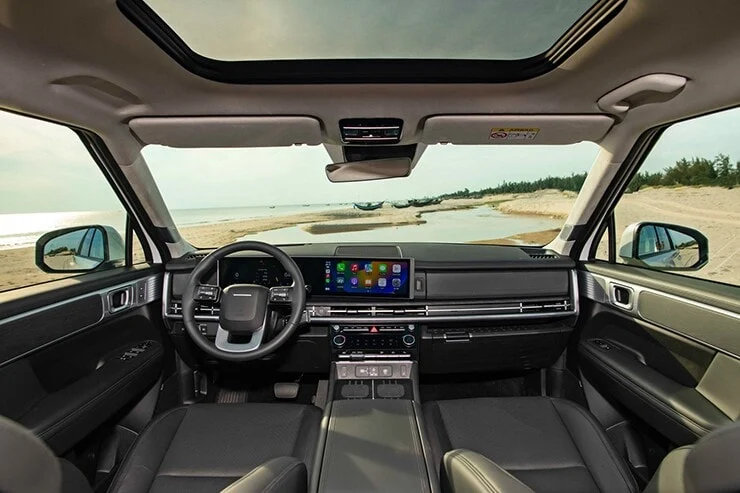 A modern cockpit with dual screens and a minimalist dashboard design.