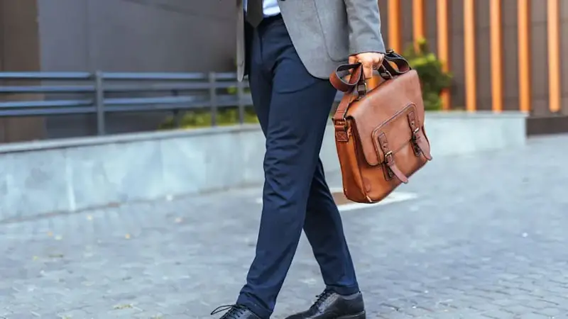 Man Walking on Street with Leather Briefcase and Formal Attire