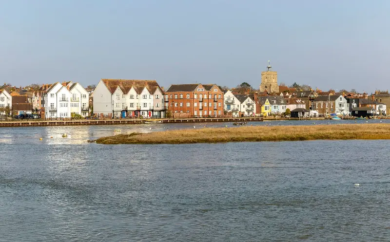 The waterfront of Wivenhoe along the River Colne, with views of St Mary’s Church’s tower and cupola - Geography Photos/2022 Universal Images Group