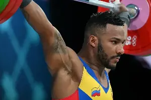 This Olympic weightlifter is utilizing his skills to help people in a stunning way