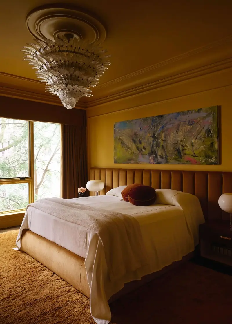 Ochre is a wonderful alternative to sunshine yellows in bedrooms: it brings all of the warmth while adding a cozy, moody feel.  (Image credit: Adrian Gaut. Design: Crystal Sinclair)