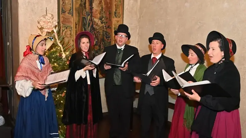 Christmas carolers performing