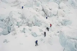 Photos show climbers attempting to scale Mount Everest despite increasing challenges