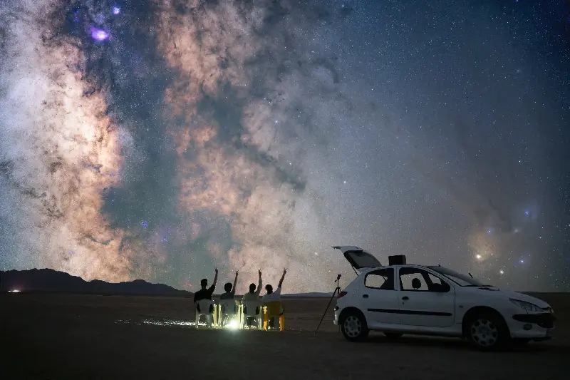 The vast white salt flats of Kutch transform into a dreamlike landscape under moonlight. 