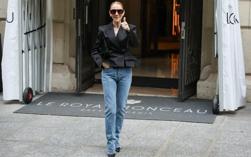 Dion dressed down an Eighties-style padded-shoulder Givenchy blazer with contemporary straight-leg jeans - SIMON WOHLFAHRT/AFP or licensors