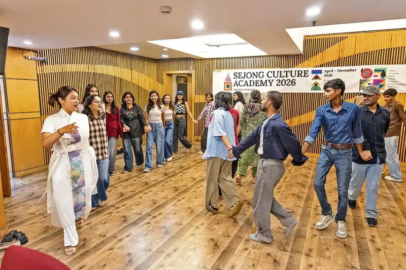 Students dancing to the rhythm of Ganggangsullae, an ancient Korean circle dance and song tradition.