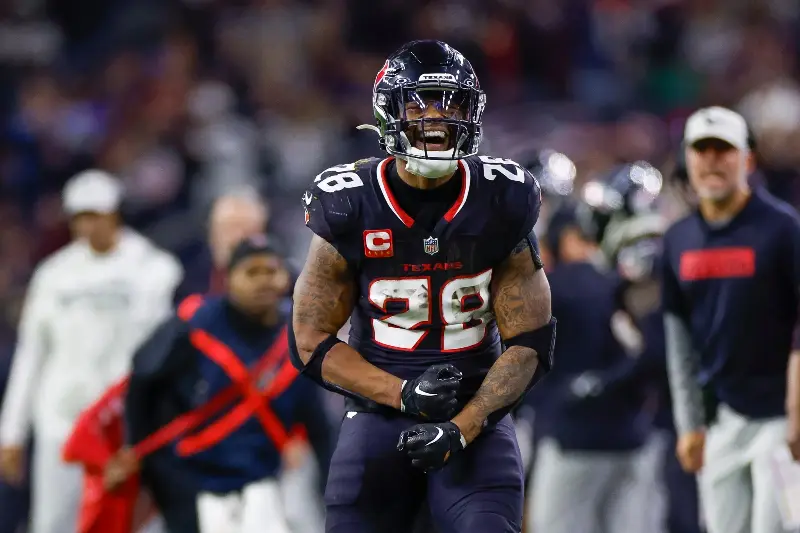 Joe Mixon #28 of the Houston Texans celebrates in the second half during the AFC Wild Card Playoff game against the Los Angeles Chargers at NRG Stadium on January 11, 2025 in Houston, Texas. (Photo by Brandon Sloter/Getty Images)