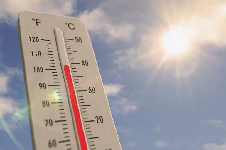 Thermometer on blue sky and shining sun. Heat wave, increase high temperature and warm weather in summer. 3D illustration concept global warming and climate change.; Shutterstock ID 2179556963; purchase_order: aj; job: ; client: ; other:
