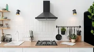 5 signs your kitchen chimney might not be working, from sticky cabinets to food odours