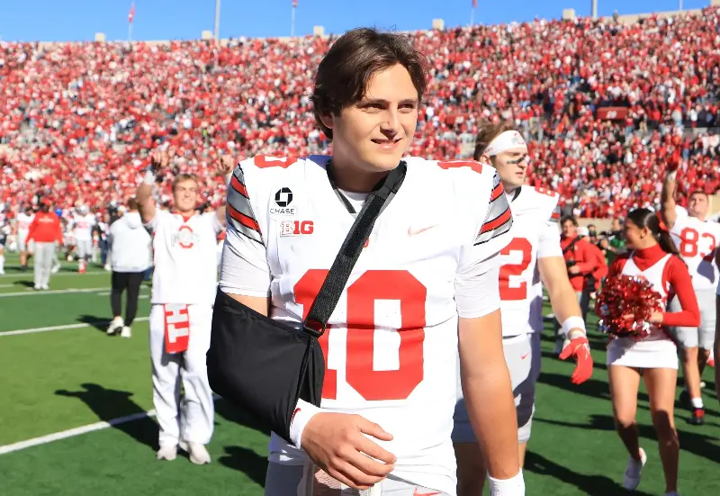 Julian Sayin #10 of the Ohio State Buckeyes walks off the field with his arm in a sling after defeating the Indiana Hoosiers at Memorial Stadium on October 17, 2026 in Bloomington, Indiana. (Photo by Justin Casterline/Getty Images)