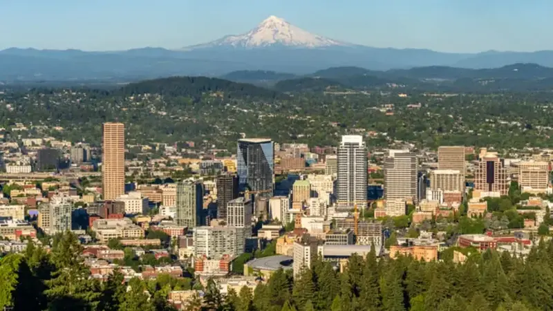An aerial view of the city of Portland, Oregon (with Mount Hood in the background) along the Cascadia subduction zone.