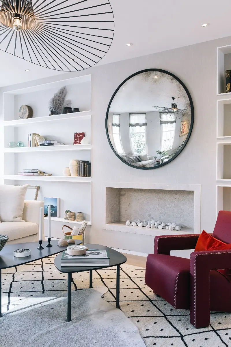 If you have a smaller rug you love, simply layer it over a larger area rug for extra texture and dimension. (Image credit: Kitesgrove)