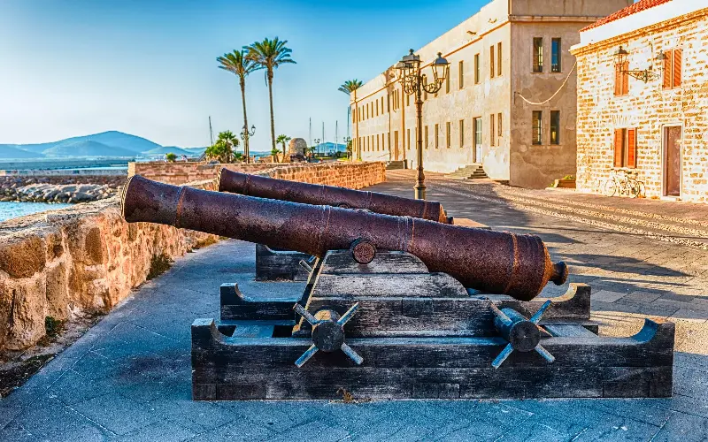 Disused cannons on the historic ramparts in Alghero - bwzenith/iStockphoto