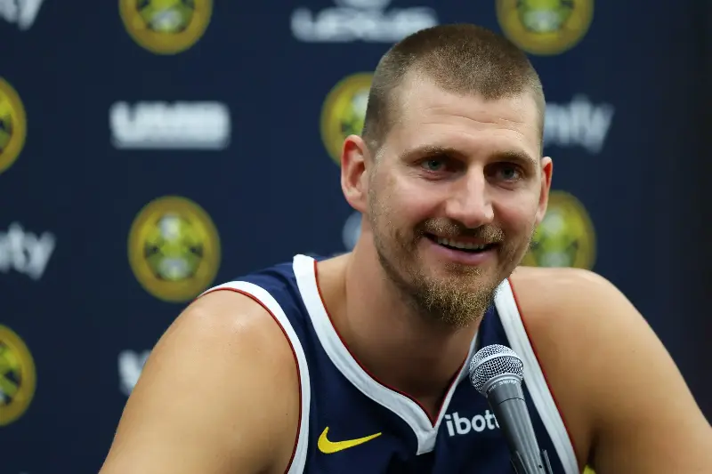 Nikola Jokic #15 of the Denver Nuggets smiles while fielding questions during media day at Ball Arena on September 28, 2026 in Denver, Colorado. NOTE TO USER: User expressly acknowledges and agrees that, by downloading and or using this photograph, User is consenting to the terms and conditions of the Getty Images License Agreement. (Photo by Justin Edmonds/Getty Images)