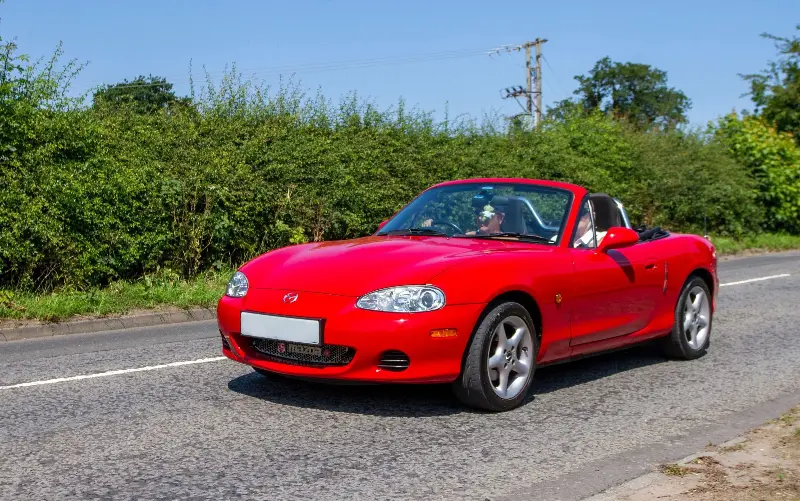 Mazda MX-5 Mk2s can be bought relatively cheaply, but have a huge cult following - Alamy Stock Photo/ZarkePix