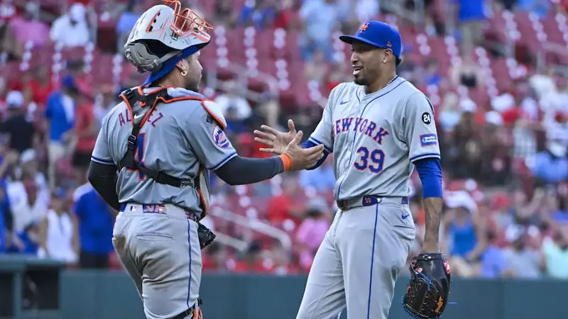 New York Mets relief pitcher Edwin Diaz celebrates with catcher Francisco Alvarez