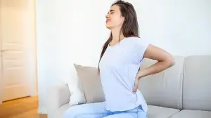 Back pain in your 20s? Doctors explain why young adults are developing ‘ageing’ spine problems and how to prevent it
