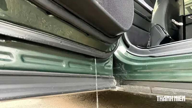 There's a small hole at the bottom edge of the car door. Is it a manufacturing defect or does it serve a specific function? - Photo 2.