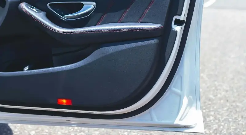 There's a small hole at the bottom edge of the car door. Is it a manufacturing defect or does it serve a specific function? - Photo 4.