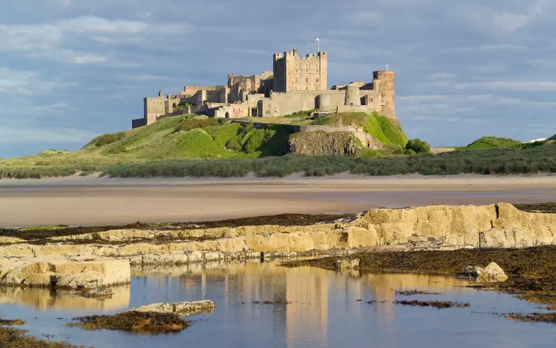The three-mile stretch of beach from Seahouses offers a spectacular approach to Bamburgh Castle - P A Thompson/Bank RF