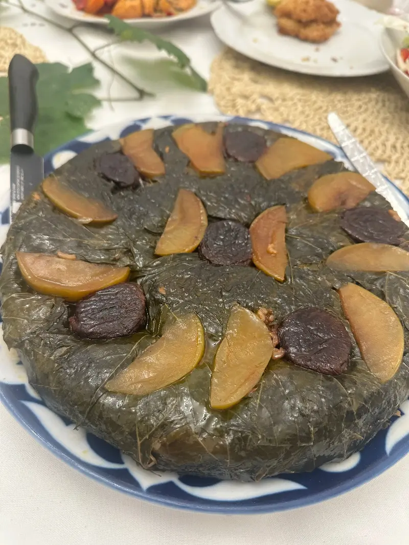 Rice cake wrapped in wine leaves 