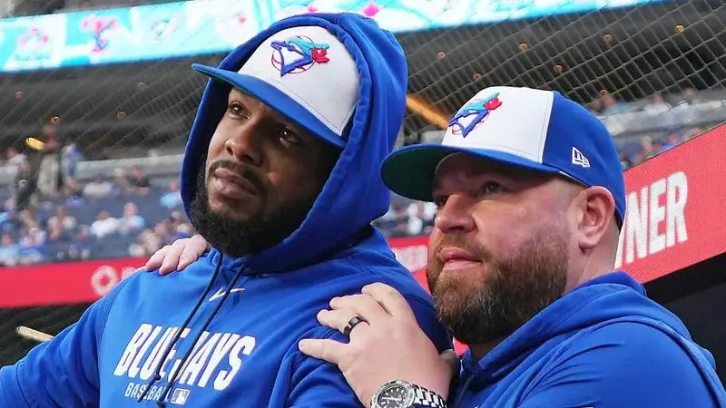 Toronto Blue Jays first baseman Vladimir Guerrero Jr. (27) talks with manager John Schneider