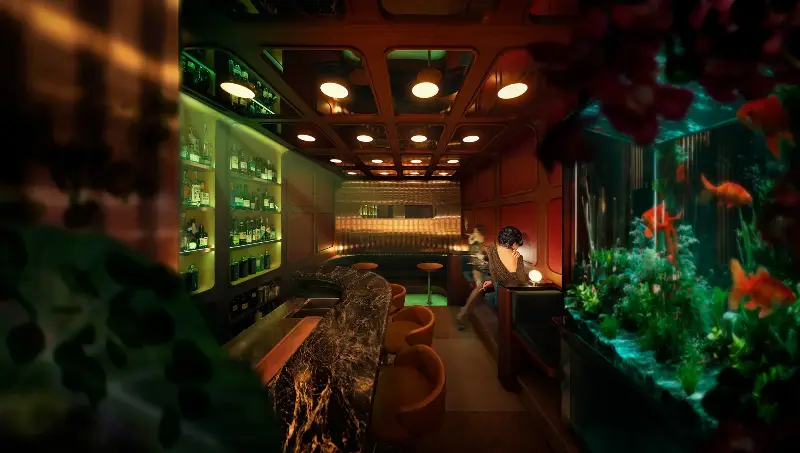 Sarah Choo Jing's photograph 2015h showing a dimly lit bar with a marble counter, backlit bottle shelves, a goldfish aquarium and a woman seated in a booth