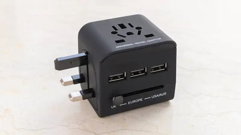 a brand new black universal adapter