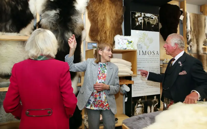 King Charles and Queen Camilla speak with Lydia Hartwell, founding director of Skyeskyns, during their visit to Portree in 2021 - William Urquhart