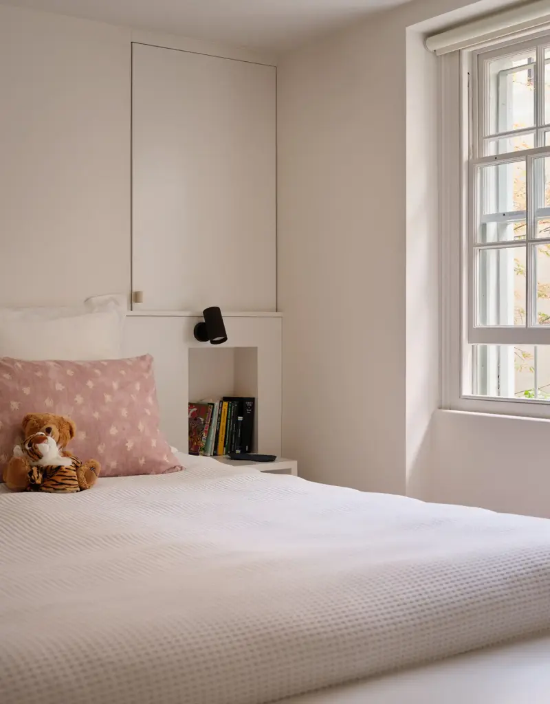 This bedroom sits in a pristine palette to preserve its ambiance as a calming, restful space.Jake Seal. Design: Russian for Fish