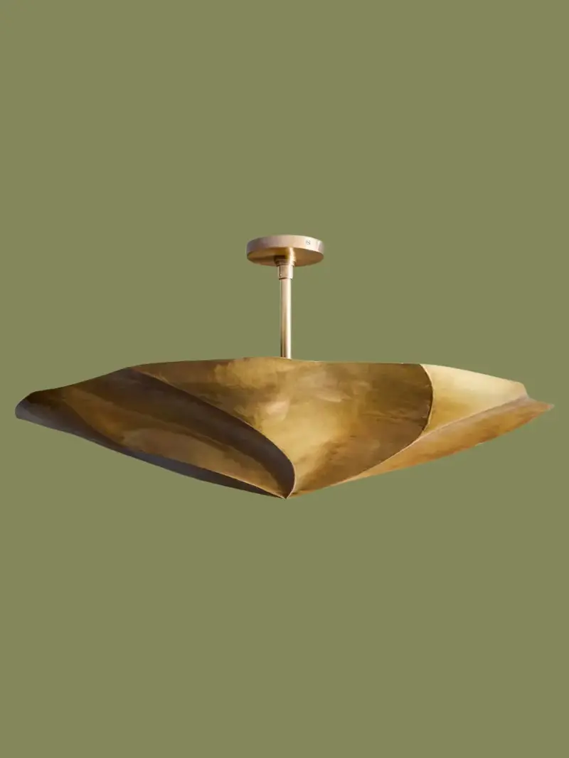 A sculpted brass pendant from Pooky