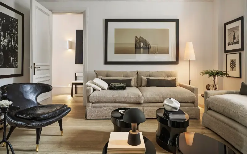 Eyeballing measurements and furniture size will end well. Here, the room is balanced, with room between pieces to move and feel comfort, even with large seating options