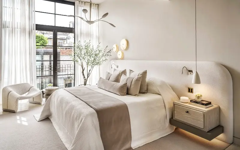 The bed is the focal point, and should be considered before any other fittings or decor