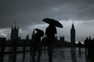 'Where has summer gone?' Londoners bemoan the awful weather as torrential rain sweeps capital