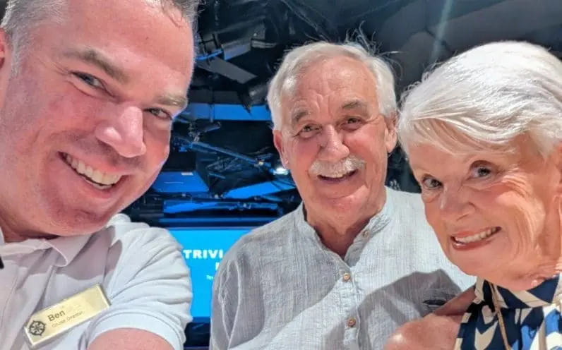 Ann and Grant with cruise director Ben Kitchen