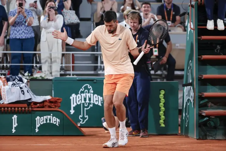 epa12991940 Novak Djokovic of Serbia celebrates his win following his Men's 1st round match against Giovanni Mpetshi Perricard of France at the French Open Grand Slam tennis tournament at Roland Garros in Paris, France, 24 May 2026. EPA/CHRISTOPHE PETIT TESSON