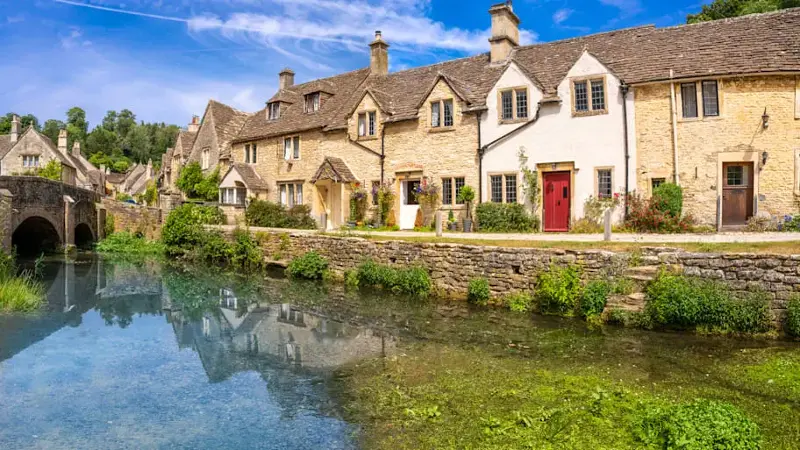 Castle Combe village and By Brook river, Wiltshire in the England Cotswolds UK