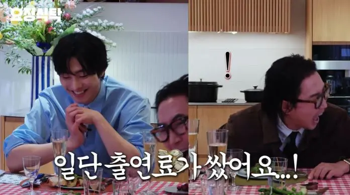 A lively dinner scene featuringAhn Hyo-seop at a table with the host, smiling and animatedly speaking, with decorative flowers in the background.