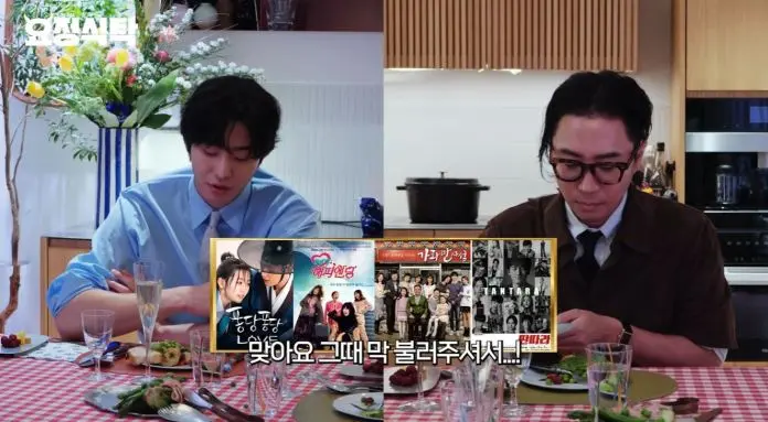Ahn Hyo-seop and the host sitting at a dining table with food, discussing various movies displayed on a screen in front of them.