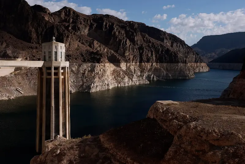 LAKE MEAD NATIONAL RECREATION AREA, ARIZONA - SEPTEMBER 01: Water intake towers at the Hoover Dam stand next to a bleached 