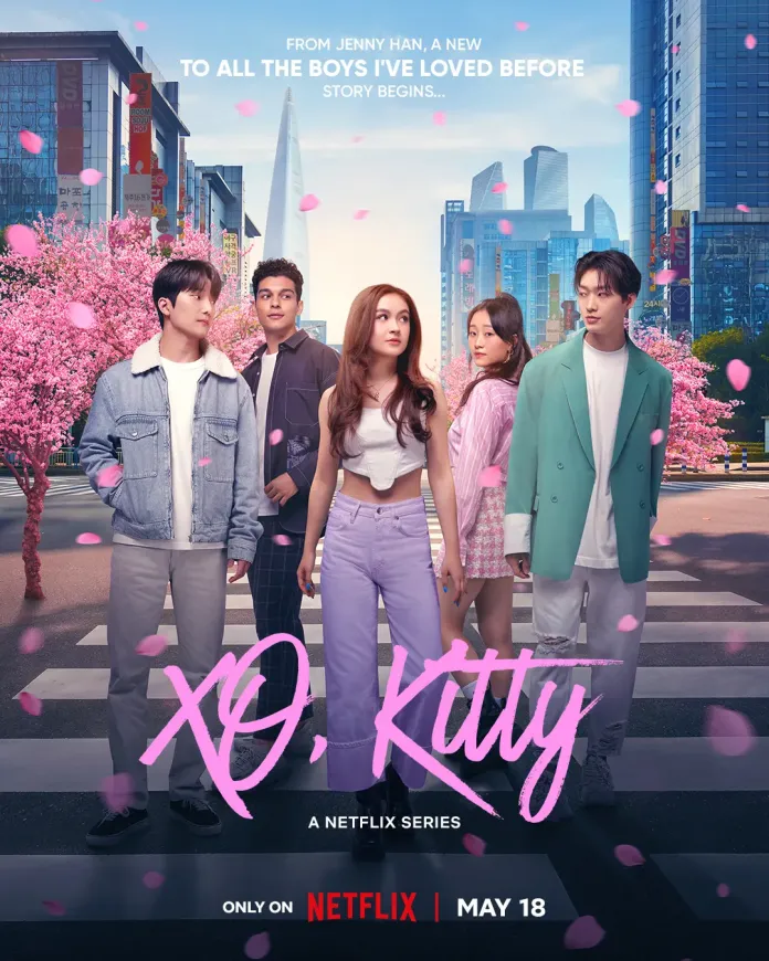 Promotional poster for the Netflix series 'XO, Kitty', featuring five characters standing on a crosswalk with cherry blossom trees and modern city buildings in the background.