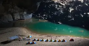 Vietnam’s Son Doong is the world’s largest cave passage, with a volume of about 38.5 million cubic meters and sections reaching 200 meters high and 150 meters wide, large enough that a 40-story skyscraper could stand inside it