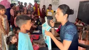 Govt school kids show Khushboo Patani their polythene school bags, she promises to bring them real ones. Watch