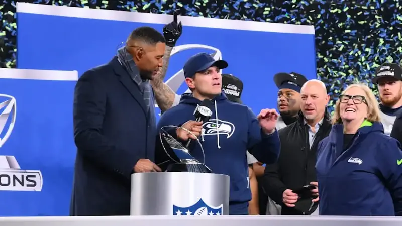 Seahawks head coach Mike MacDonald speaks on the podium after defeating the Rams in the 2026 NFC Championship Game