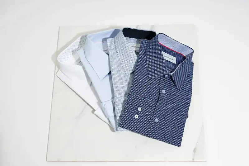 Men’s shirts traditionally button on the right, while women’s button on the left. 